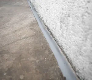 Rodent exclusion seal applied to the wall of a building